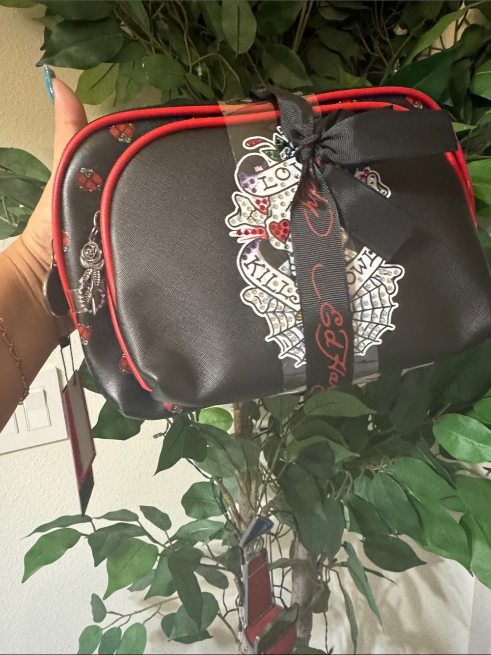 Ed Hardy cosmetic bag set duo features a "Love Kills Slowly